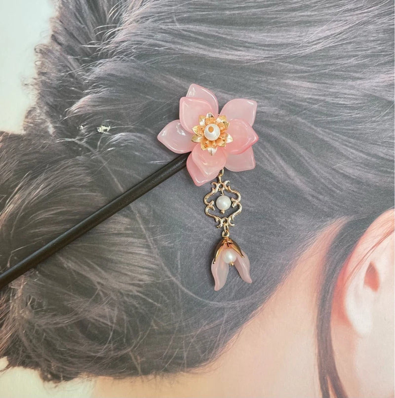 Pink peony flower hairpin with gold filigree charm and pearl drop, on a black pin