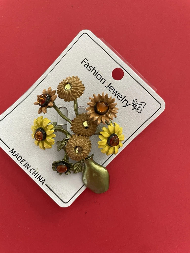 Gold-tone vintage sunflower cluster brooch pin with amber and rhinestone accents