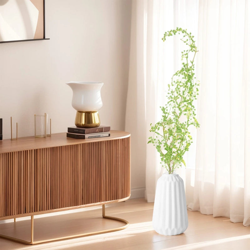 Artificial hanging ivy vine plant with small green leaves in white vase
