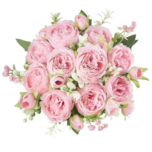 Pink artificial peony bouquet with small silk flowers and green leaves, indoor home decor