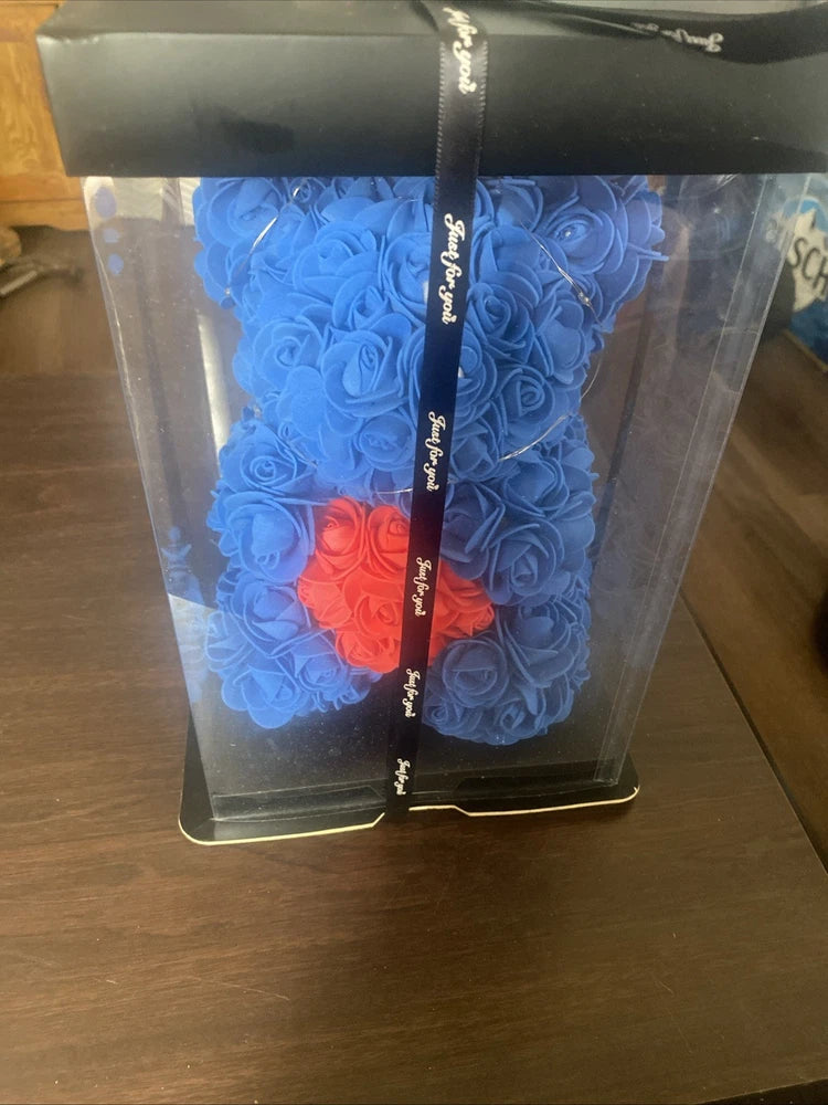 Blue foam rose bear in clear gift box with black ribbon