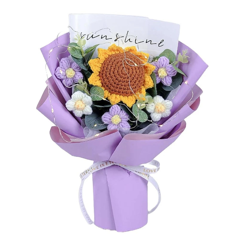 Crochet sunflower bouquet with purple and white blooms, green leaves, wrapped in lavender