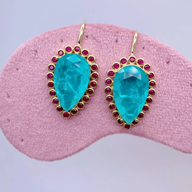 Gold-tone teardrop drop earrings with blue gem, fuchsia CZ halo, hook dangle