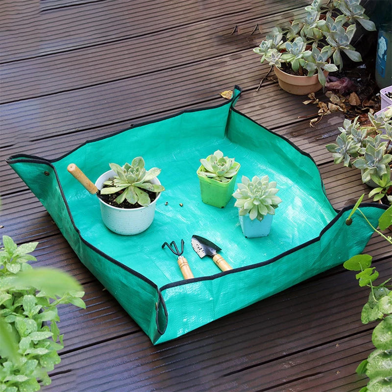 Green portable gardening mat with raised edges and corner loops for anchoring