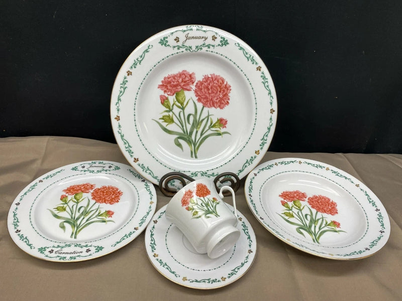 5-piece place setting: white china with green trim, pink carnation flowers, cup and saucers