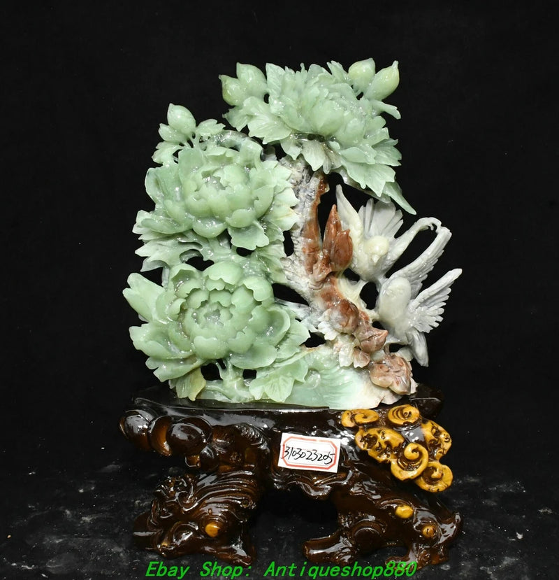 Green carved jade peony ornament statue with bird, on dark brown swirling base