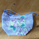 Reversible drawstring purse with hydrangea pattern and floral pattern Hydrangea