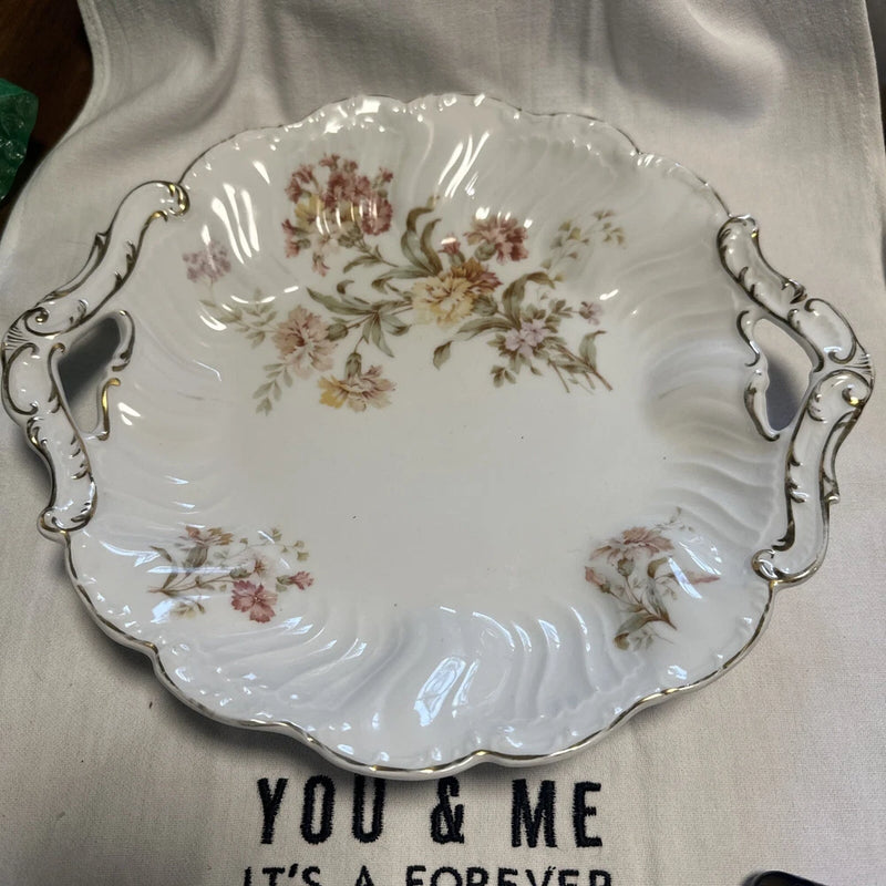 White deep serving platter with floral carnation pattern and decorative side handles
