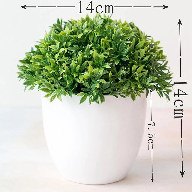 Artificial ball plant tree in white pot with dense green spherical foliage