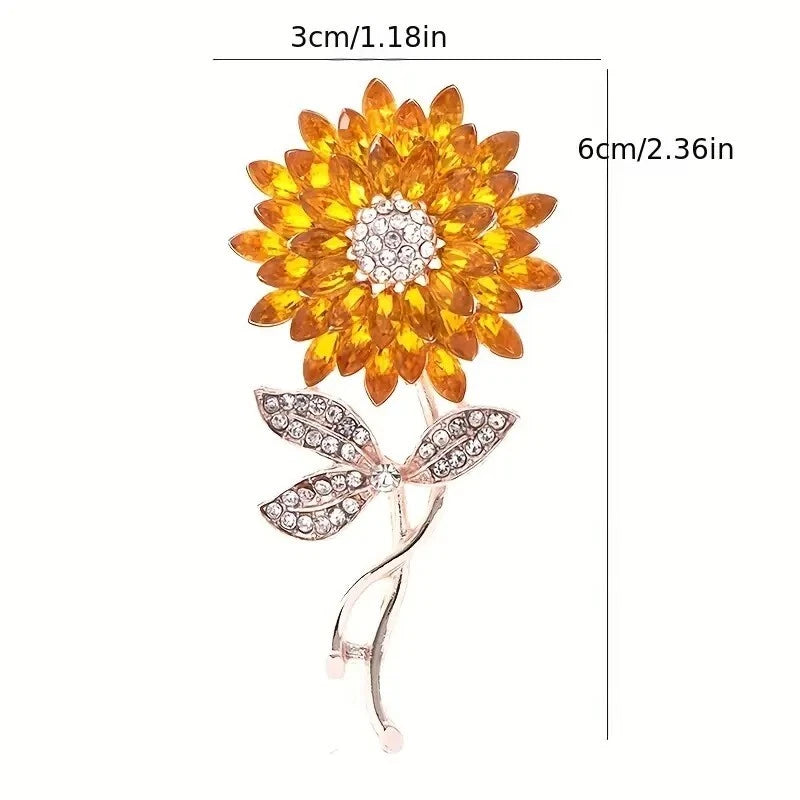 Sunflower rhinestone brooch pin with golden yellow petals and rose-gold stem detail