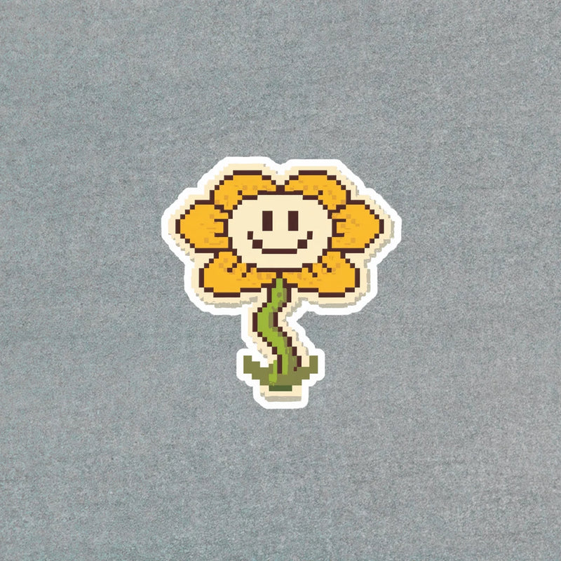 Pixel art sunflower sticker with smiling face, yellow petals, green stem, white outline