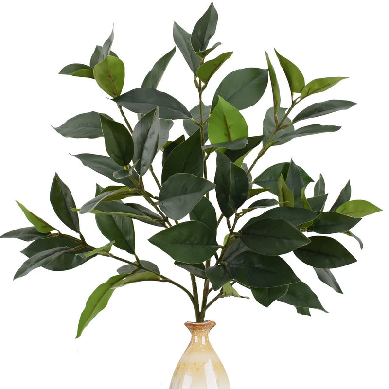 Faux greenery plant with multiple green leaf stems in a decorative vase