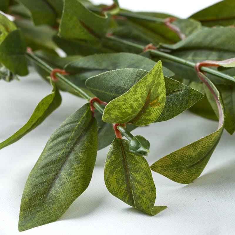 Set of 4 artificial green leaf stems with floral accents