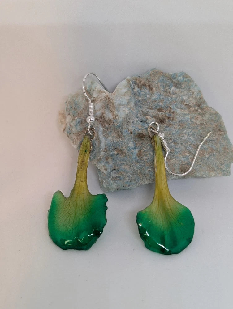 Green resin real flower earrings with dangling teardrop petals and silver hooks