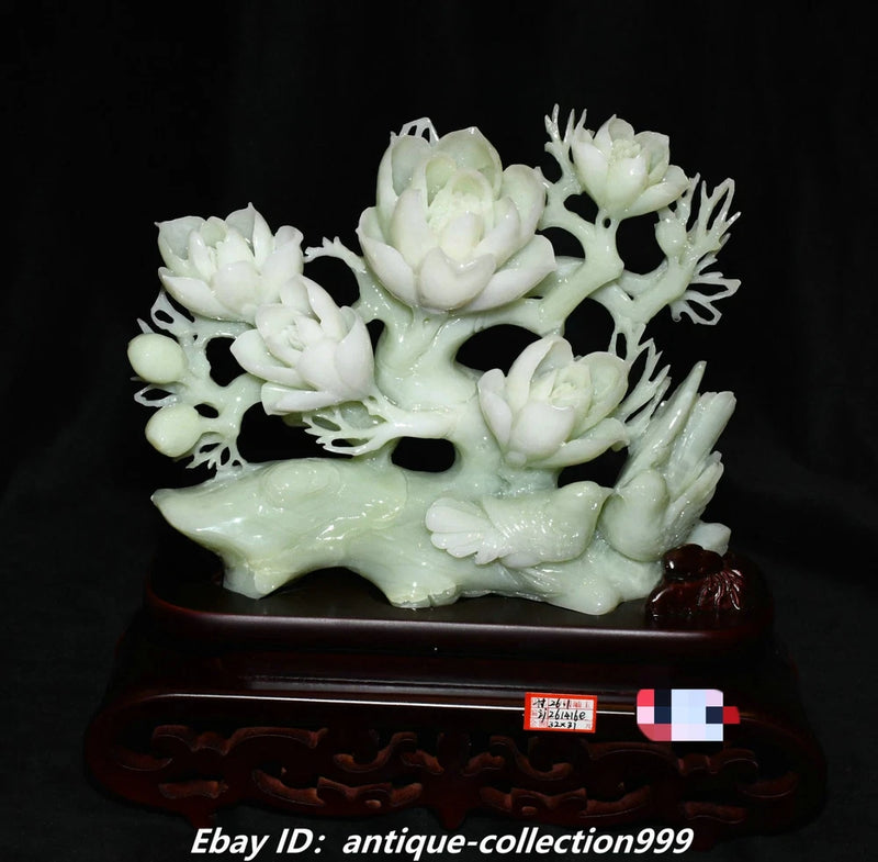 Carved pale green jade peony flower and bird statue with ornate base