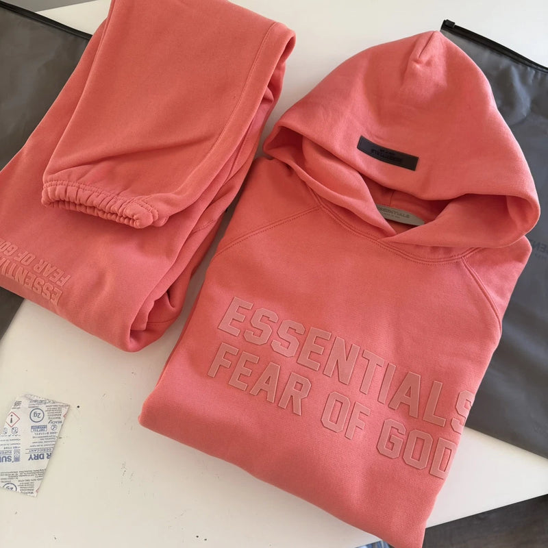 Coral Essentials Fear of God hoodie and matching sweatpants set, pullover hood and joggers