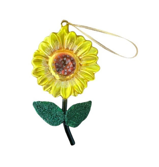 Yellow glass sunflower ornament with speckled center, green leaves, hanging loop and string