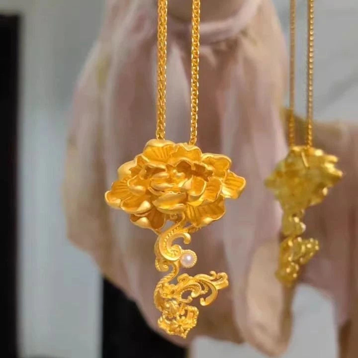 Gold peony flower necklace with layered pendant and small pearl drop, long chain