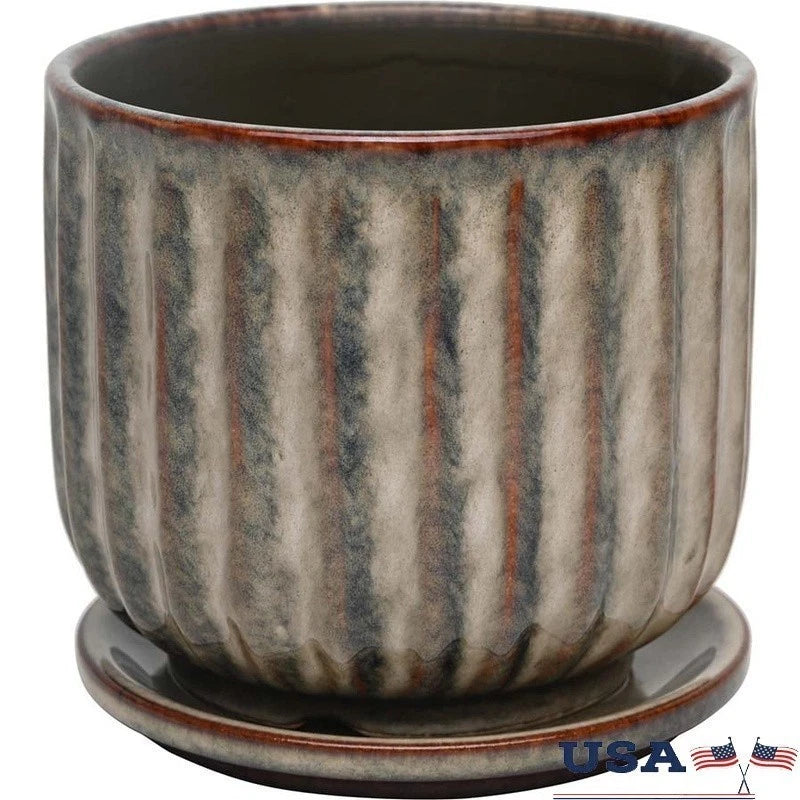 Gray ceramic planter pot with vertical speckled stripes and wide round rim