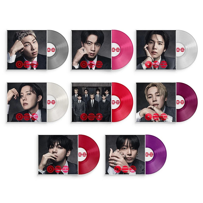 Set of vinyl records with photo sleeves and colored discs in pink, purple, and gray