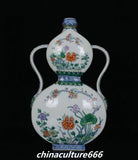 Decorative porcelain double gourd vase with peony and lotus floral motifs, blue accents