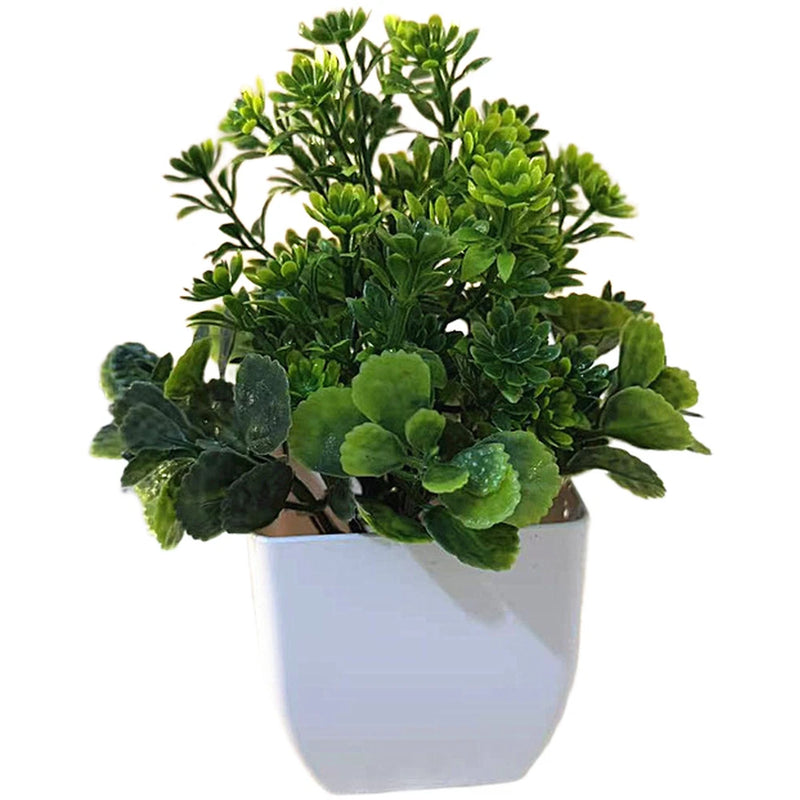 Artificial leafy plant with green foliage in a white square pot