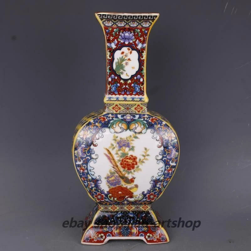 Ornate porcelain vase with gilded trim, peony floral and bird on four sides