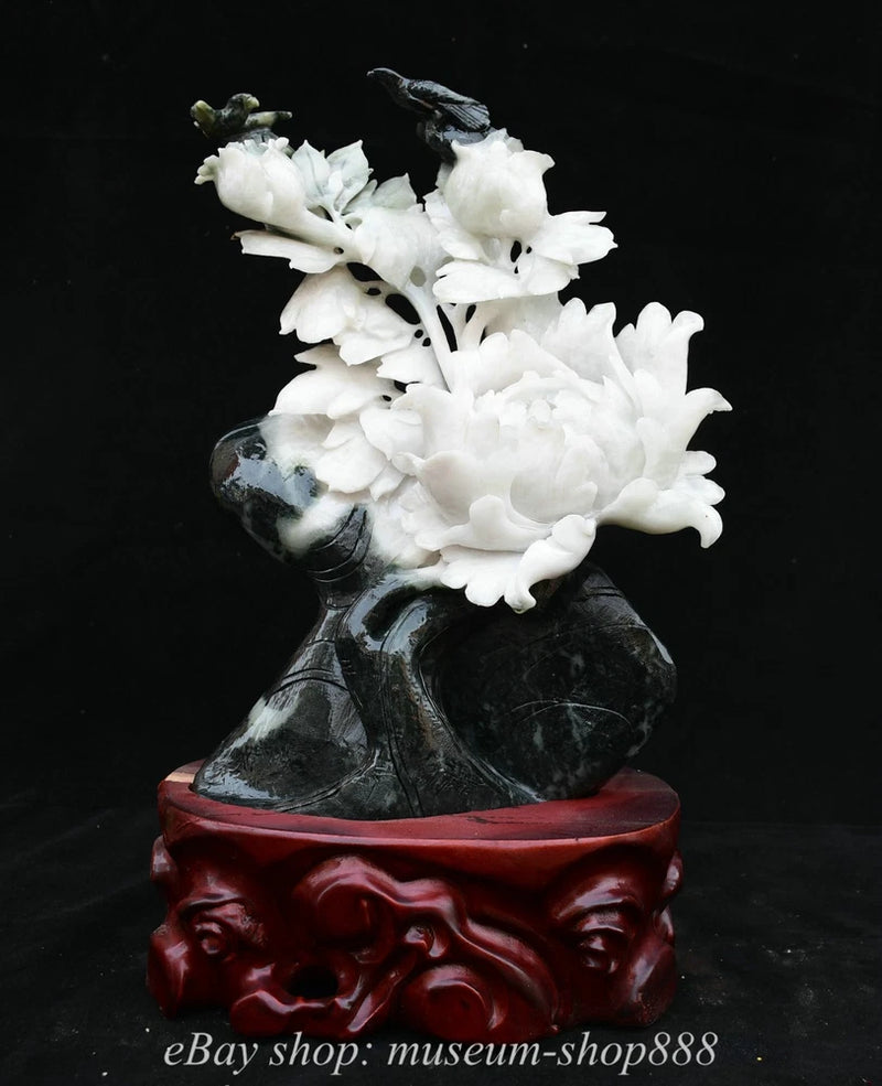 Carved peony flower statue with white blooms on dark sculpted base