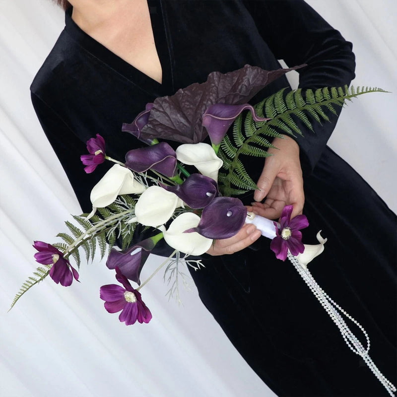 Faux calla lily bouquet with white and purple blooms, fern greenery, beaded handle