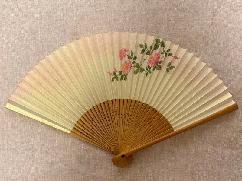 Japanese folding fan with cream pleated paper and pink peony flower pattern