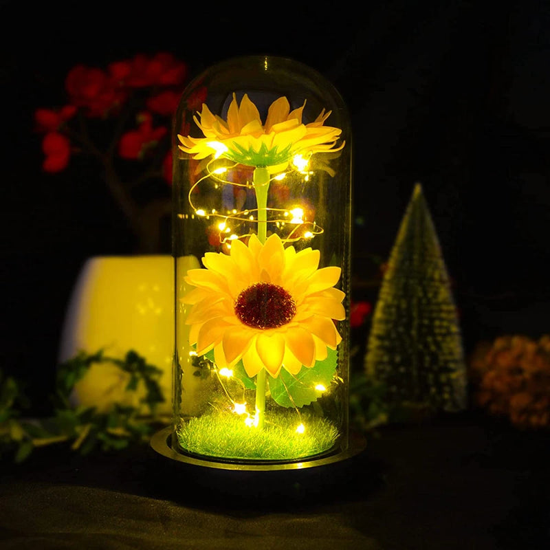 Globe glass dome with artificial sunflower and warm LED fairy lights