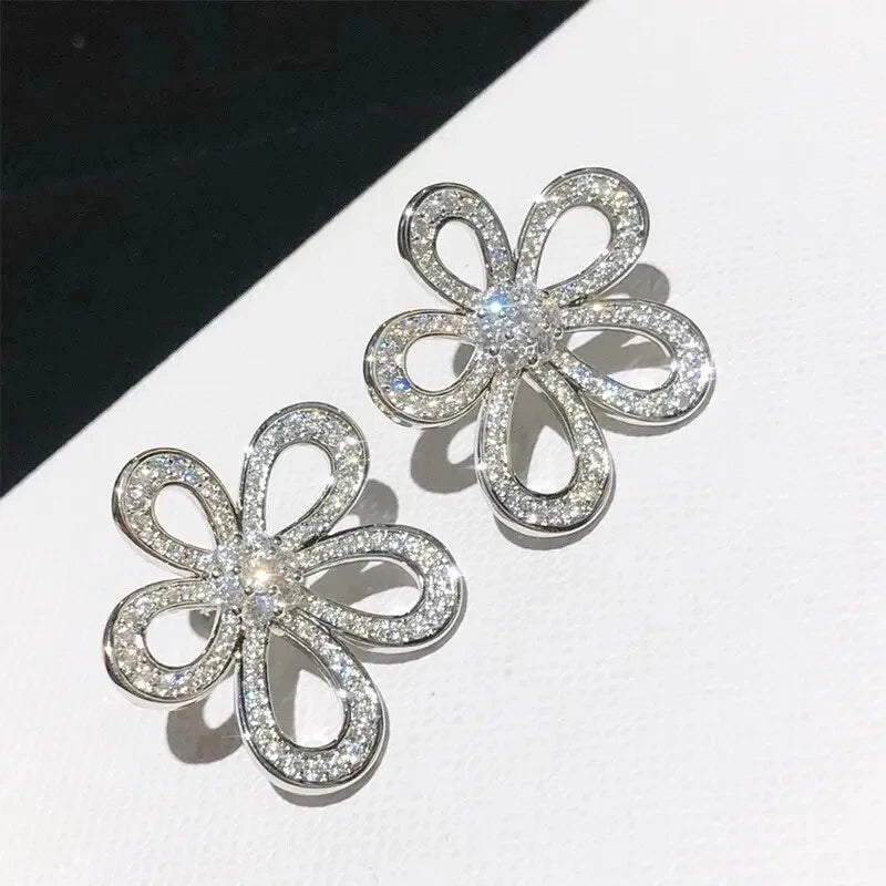 Sparkling sunflower flower stud earrings, silver-tone with clear crystal center and petals