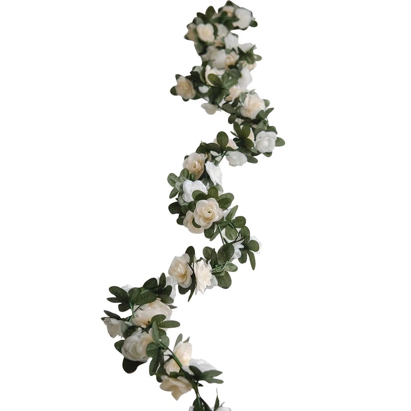 Artificial mini rose flower garland on wire, white/cream blooms with green leaves