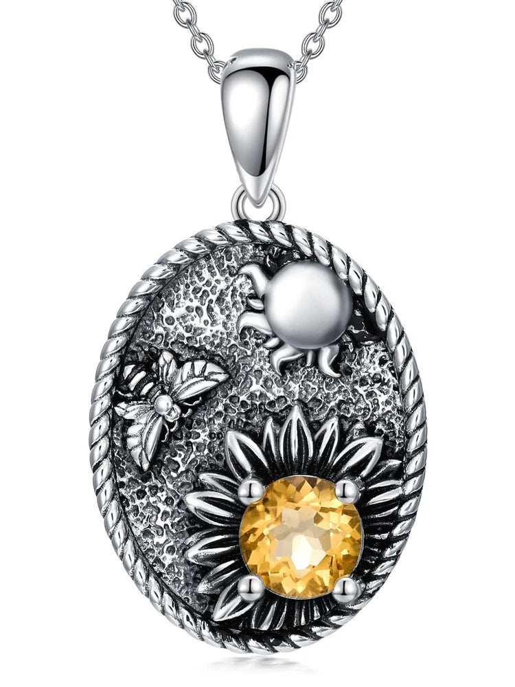 Sterling silver sunflower pendant necklace with round yellow gemstone and leaf accents