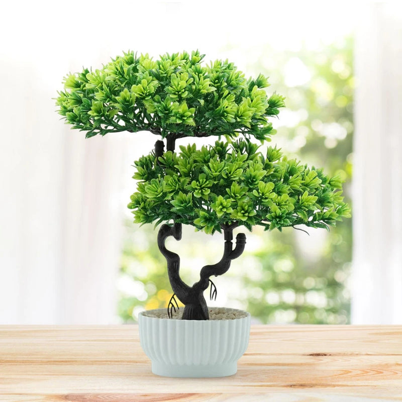 Artificial bonsai tree in light gray ribbed pot with lush green foliage