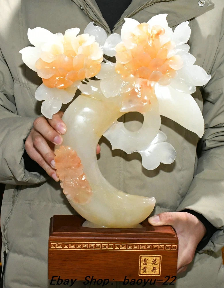 Carved jade peony flower hollow sculpture, translucent white and peach with crescent base