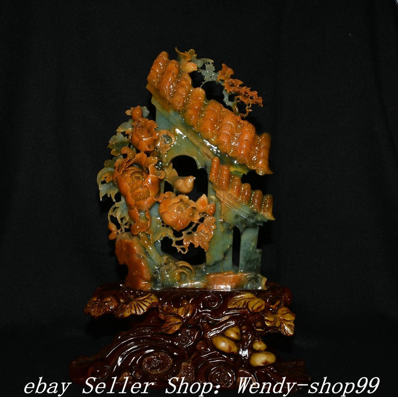 Ornate carved door statue with peony blossoms, bird, and magpie motif, green and amber