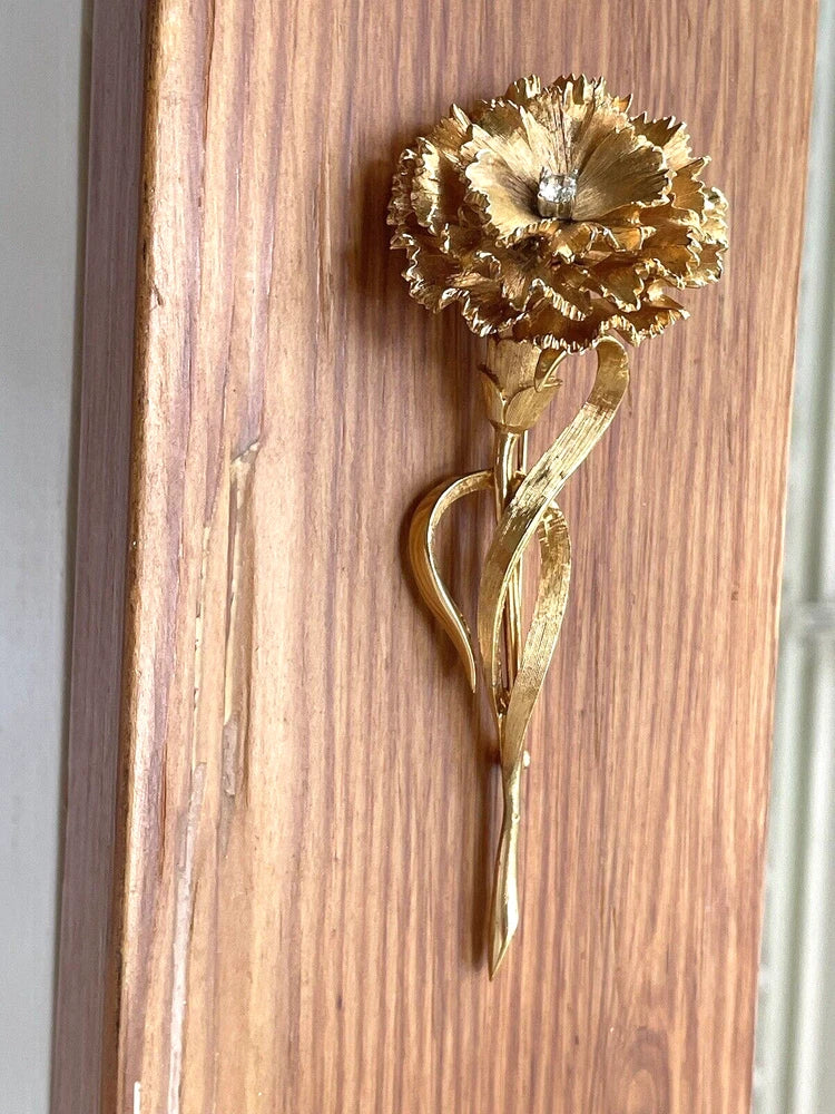 Vintage gold tone carnation brooch pin with flower and leaf detail