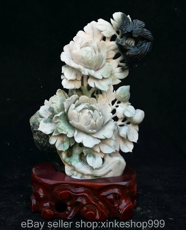 Natural jade carving of peony flowers with a small bird, on a red base