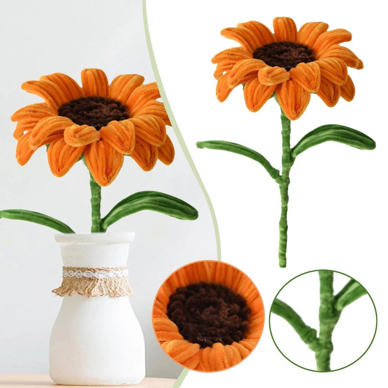 Artificial orange sunflower with dark brown center, green stem and leaves, on display