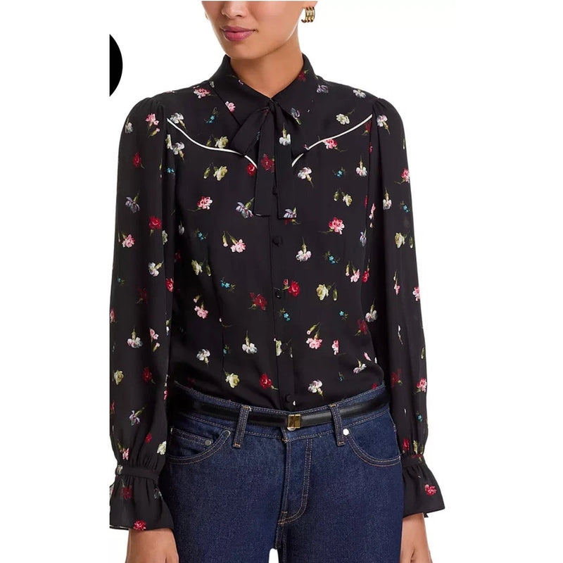 Black floral blouse with tie-neck bow, long sleeves, and button cuffs
