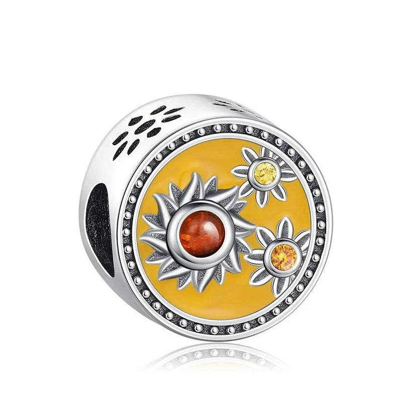 925 sterling silver sunflower charm with yellow enamel disc, silver petals, jeweled border