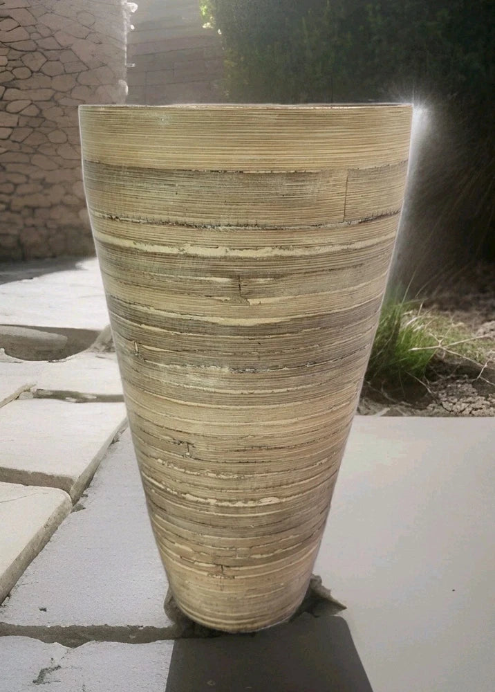 Natural beige spun bamboo vase with woven horizontal bands, tall cylinder container