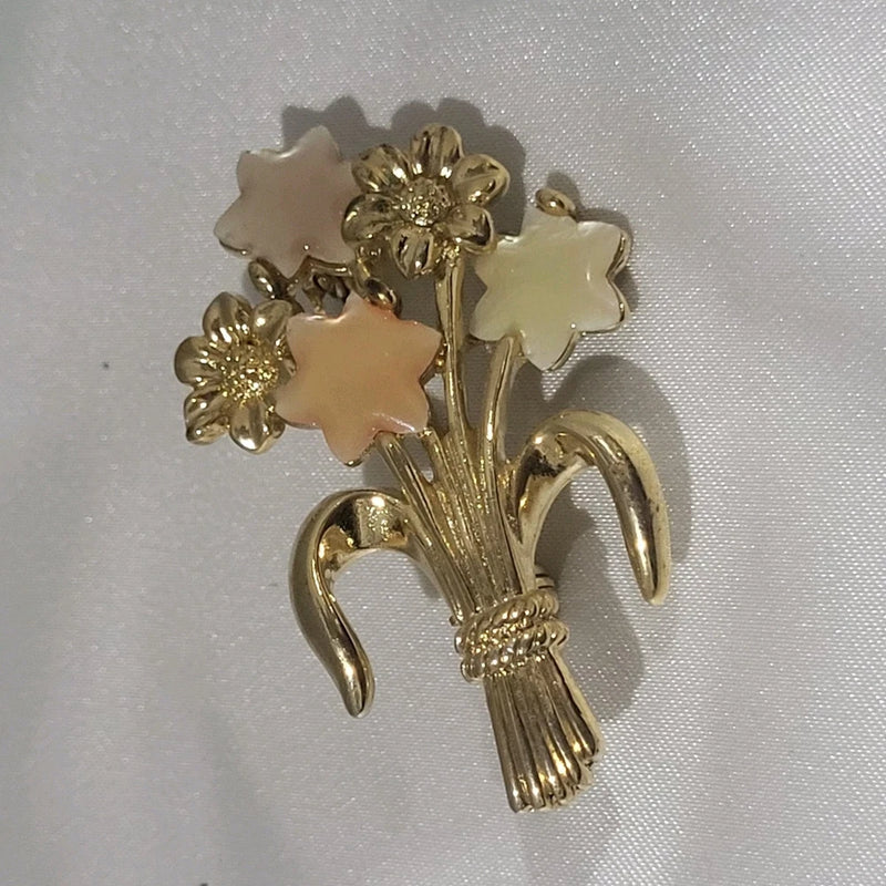 Gold-tone enamel flower brooch with pale pink ruffled blooms and curved pinbacks