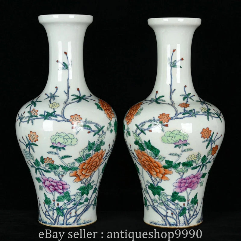 Pair of white porcelain vases with floral peony, orange and purple accents, and blue branch designs