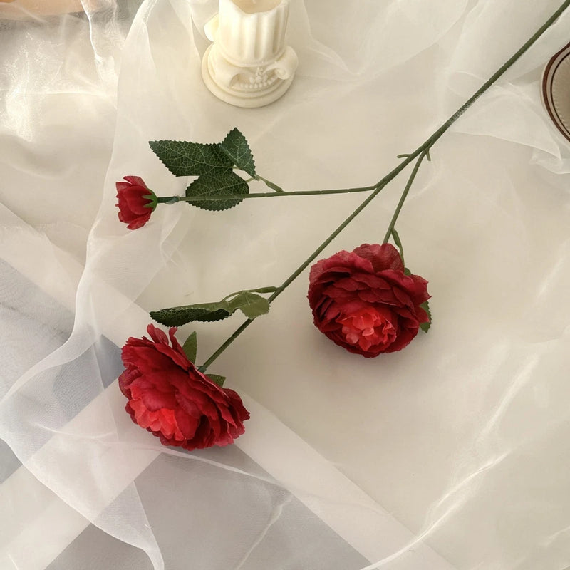 Artificial red peony flower stems with green leaves, three blooms