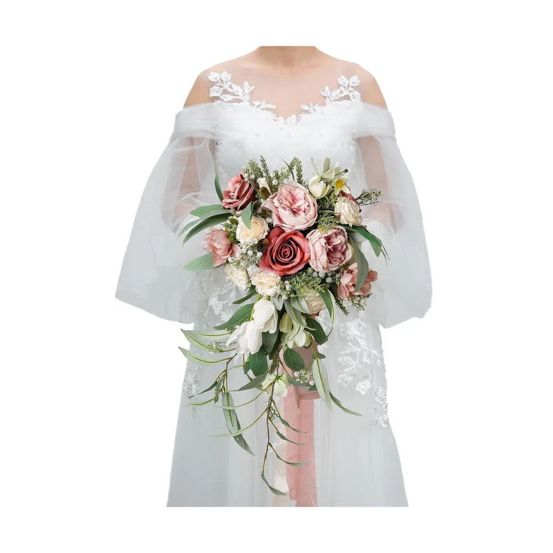 Dusty rose cascading bridal bouquet with pink and cream roses and green foliage