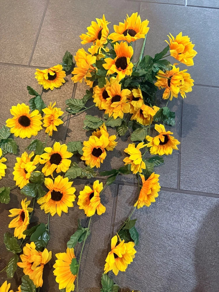 Artificial sunflower bouquet with long green streamers and yellow blooms
