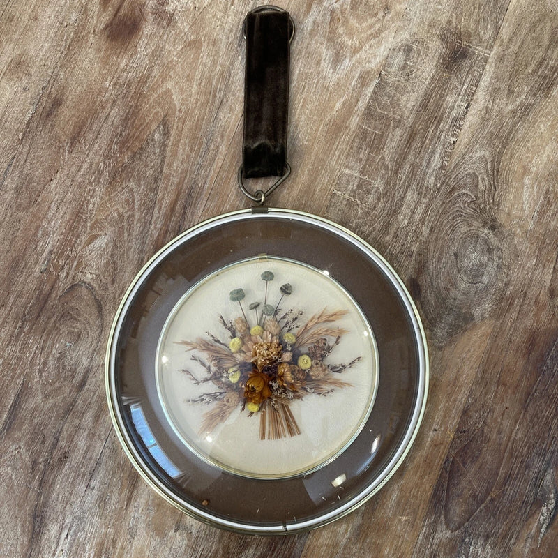 Round dried flower wall art with convex glass and metallic dome frame