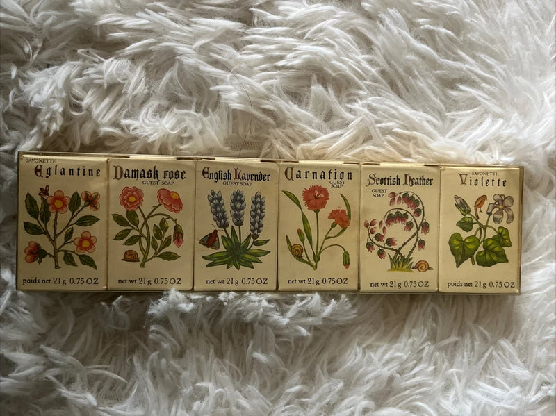 Floral soap gift set with illustrated box labels in rose, lavender, and violet tones